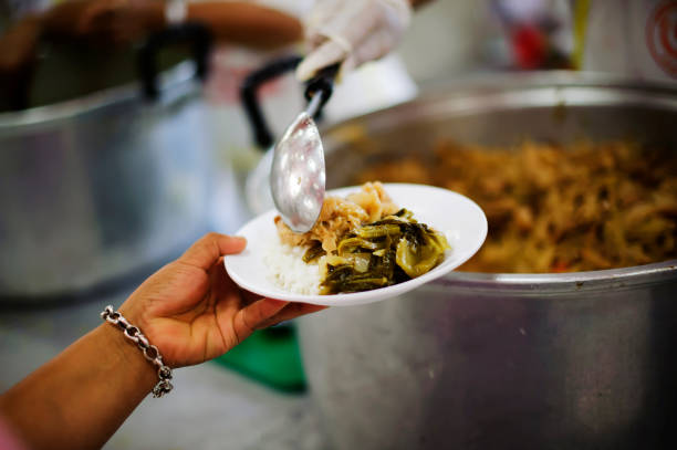 istock The poor are reaching for food, are sociable. 1083527748
