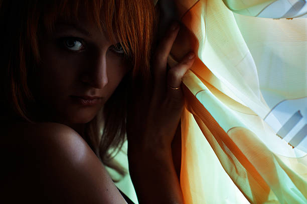 istock Beautiful red-haired girl is hiding 108353408