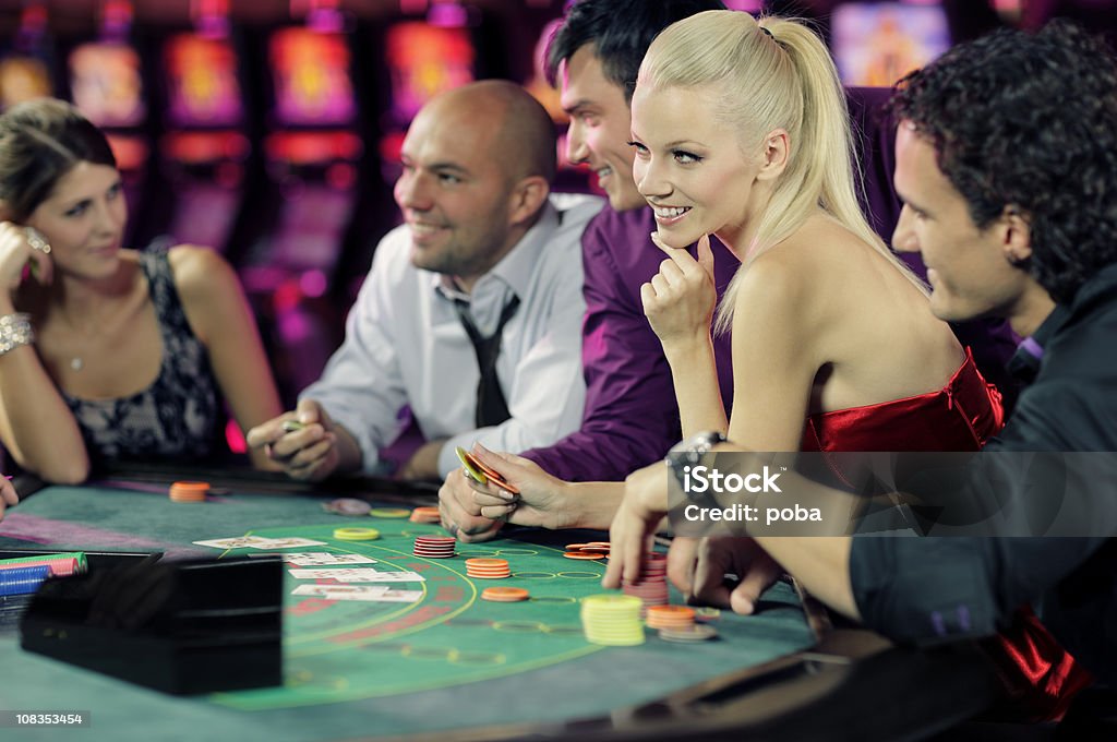 guys and girls playing black jack in casino  Blackjack Stock Photo