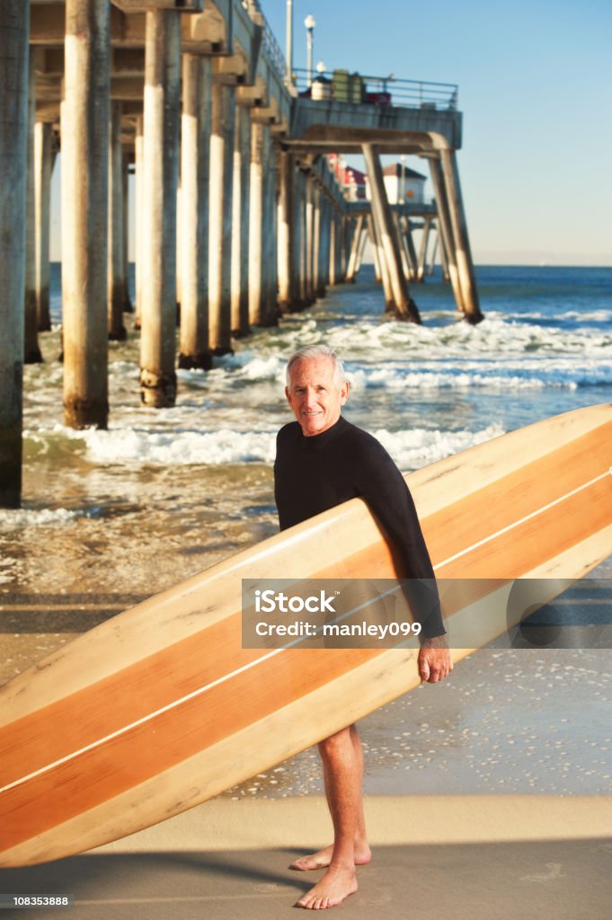 senior surfer portrait by the pier  60-64 Years Stock Photo