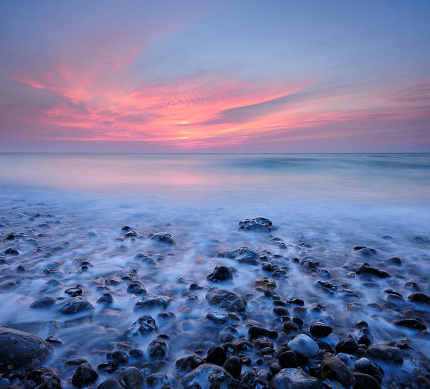 istock Tranquil Coastal Sunset on Pebble Beach 108354252