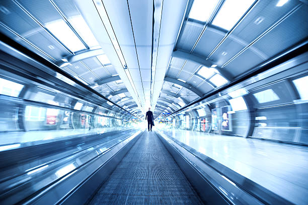空港の歩道 - escalator people city blurred motion ストックフォトと画像