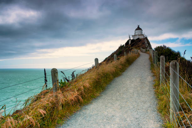 istock Cloudy day at the Nugget Point Lighthouse with dramatic sky 1083546116