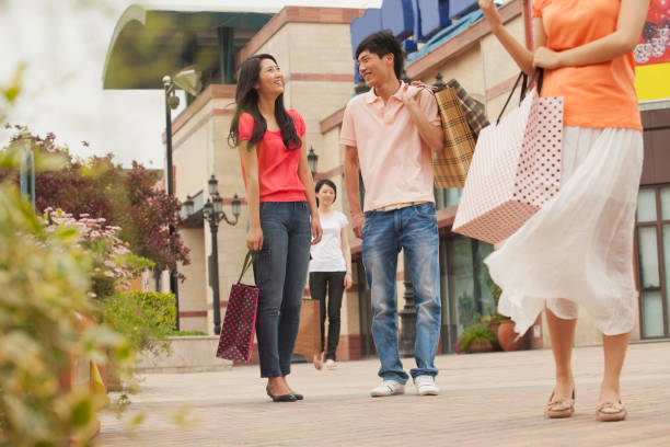 istock Chinese couple shopping together 1083547192
