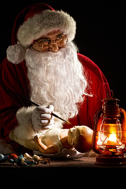 istock Santa Claus painting a toy 108355245