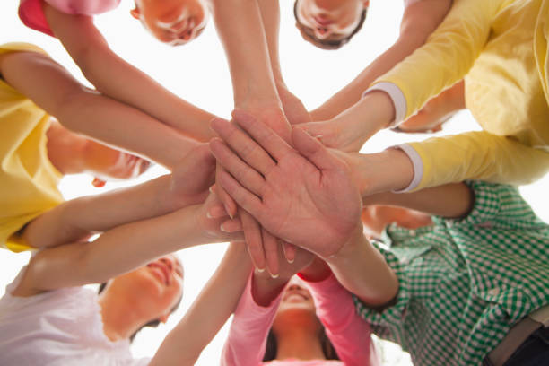 istock Group of Chinese friends with hands in circle 1083555104