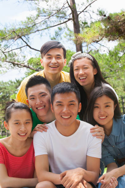 istock Group of Chinese friends hugging 1083555138