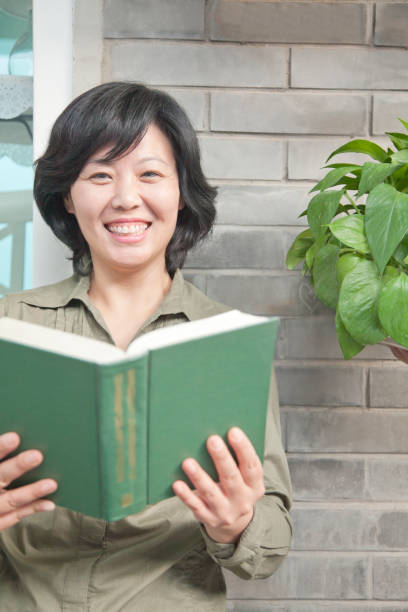 Chinese woman reading book