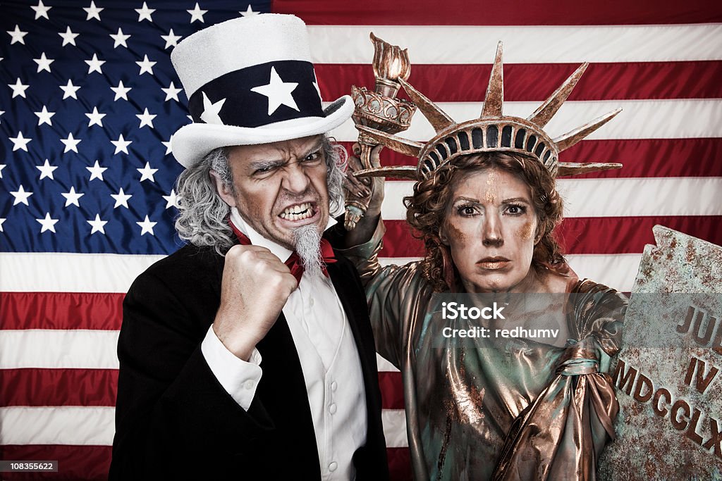 Злая Дядя Sam и Lady Liberty - Стоковые фото Uncle Sam роялти-фри