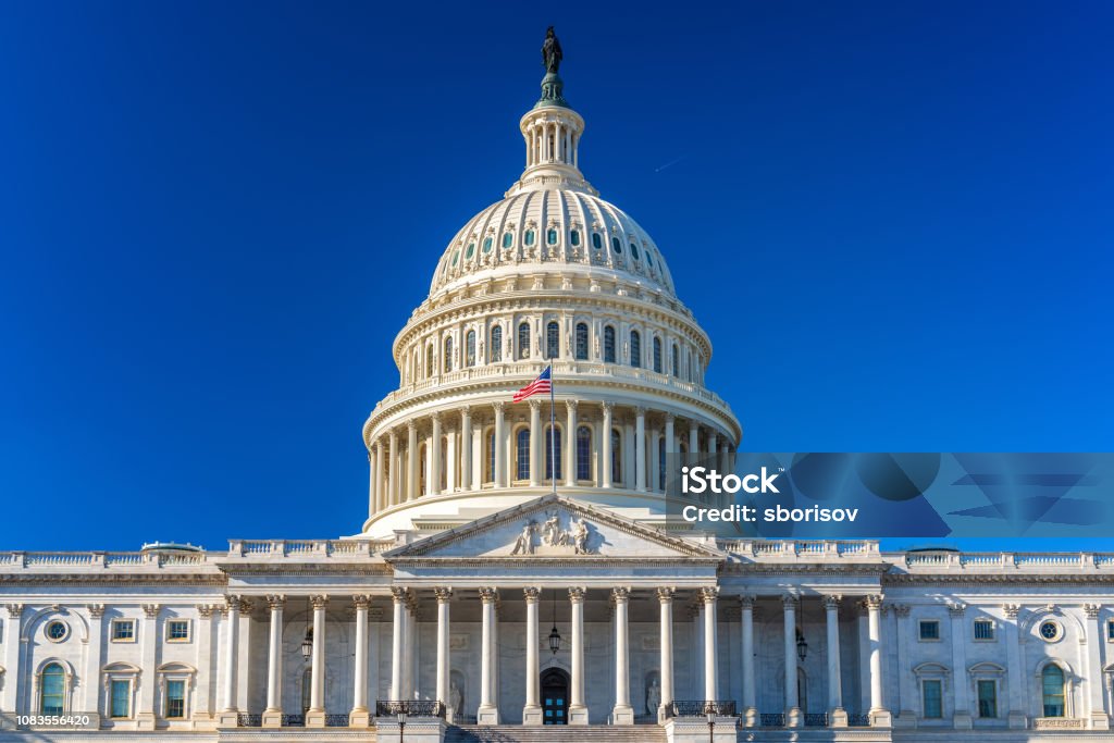 US Capitol at sunny day US Capitol over blue sky Capitol Building - Washington DC Stock Photo