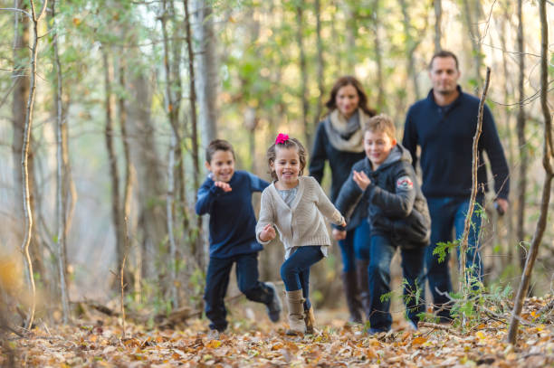 istock Family hiking through the woods 1083556588