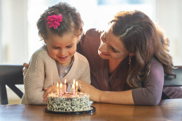 istock Birthday girl with her mom 1083556600
