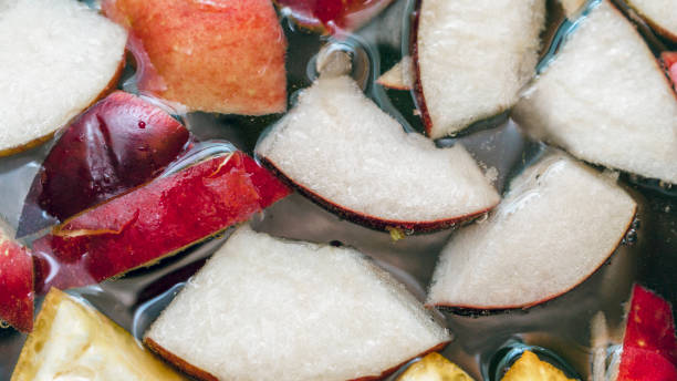istock Colorful Apple Slices, Fruit Mix In A Pot.  Refreshing Fruit Apple Cider Punch Party Drink. Organic Food And Beverage Background. 1083558508