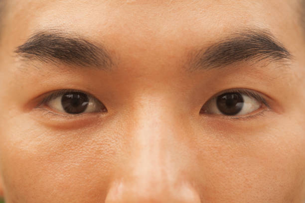istock Close up of Chinese man's eyes 1083558922