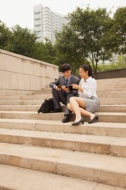 istock Chinese business people reading planner 1083558976