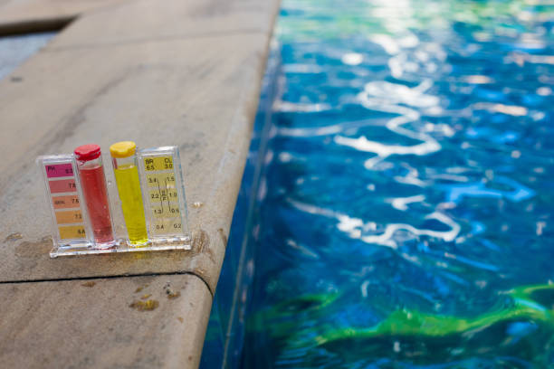 PH Test Kit on swim pool river water inspector Equipment PH Test Kit on swimming pool chlorine and fresh river water inspector. Procedure to check day week level of safety in pool water to make sure water is clean and can swim bromine symbol stock pictures, royalty-free photos & images