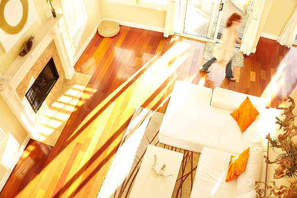 istock Blurred woman walking through modern living room from above 108355985