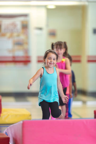 istock Young girls running in a gym 1083560228