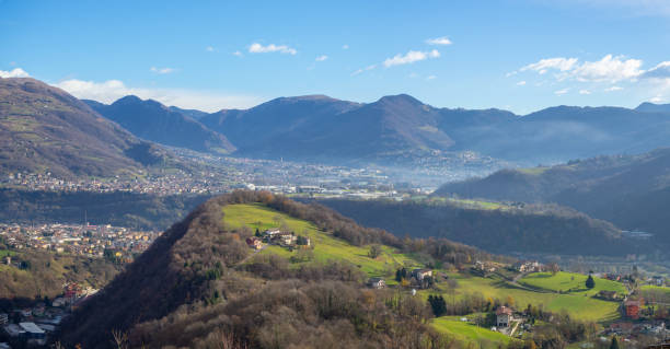 Drone aerial view to the Seriana and Gandino valley in fall season. Landscape from the village of Orezzo, Bergamo, Italy stock photo