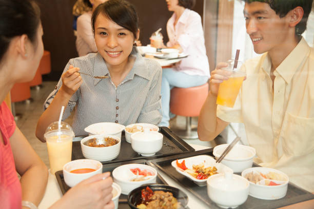 istock Chinese friends eating together in cafe 1083564128