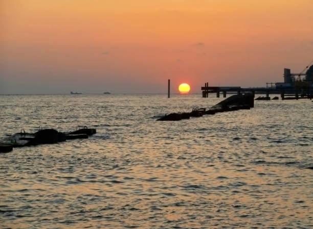 istock Red round sunset and calm sea at summer evening 1083569330