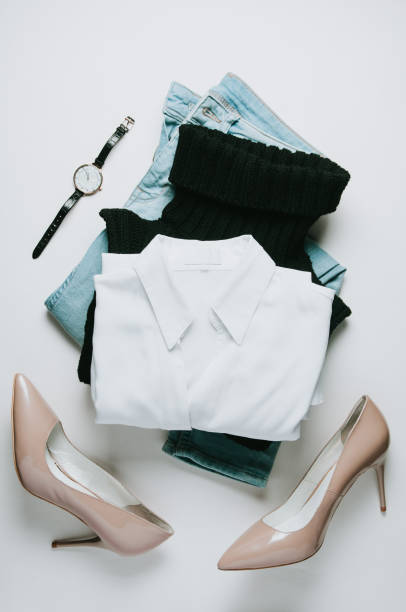 istock Women's clothing on a pale background. Flat lay and top view 1083569692