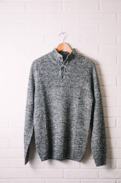 istock Men's winter sweater on brick wall background 1083569698