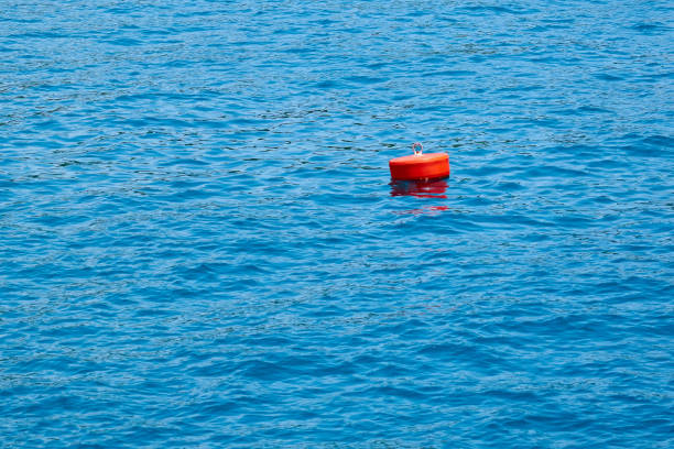 istock Red buoy on the blue sea. 1083575444
