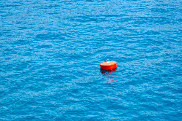istock Red buoy on the blue sea. 1083575550