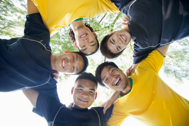 istock Chinese soccer players standing in circle 1083575768