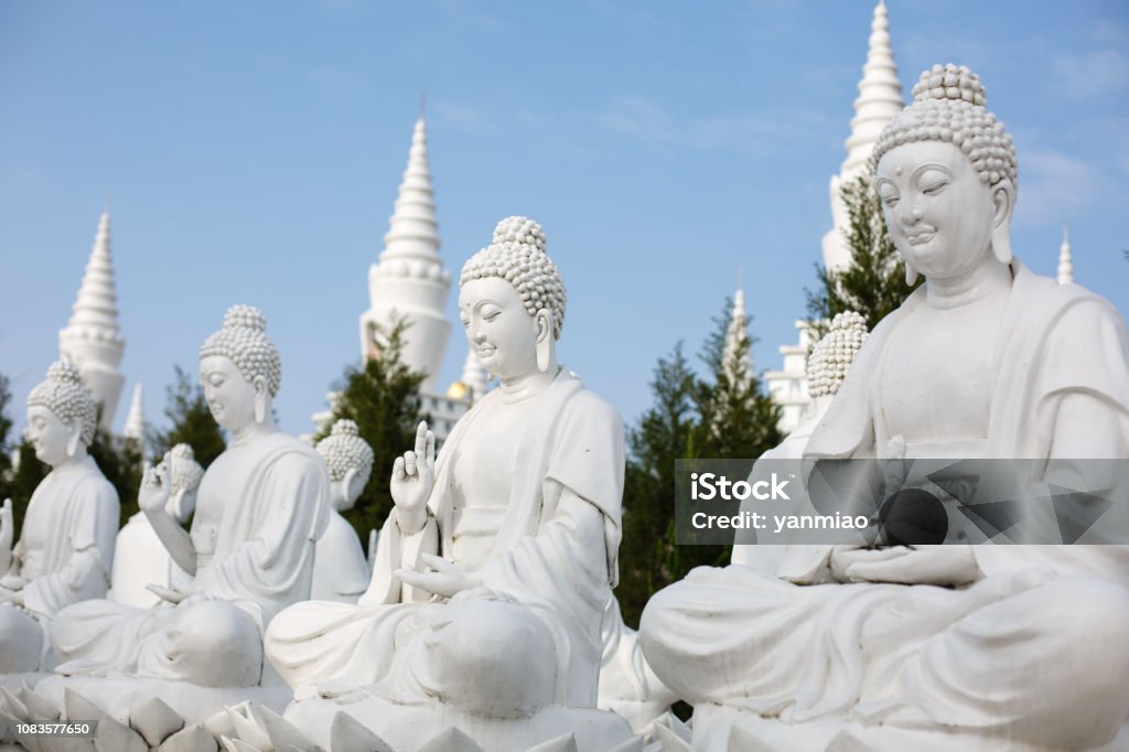 Buddhist sculpture The beautiful white pagoda is under the blue sky Architecture Stock Photo