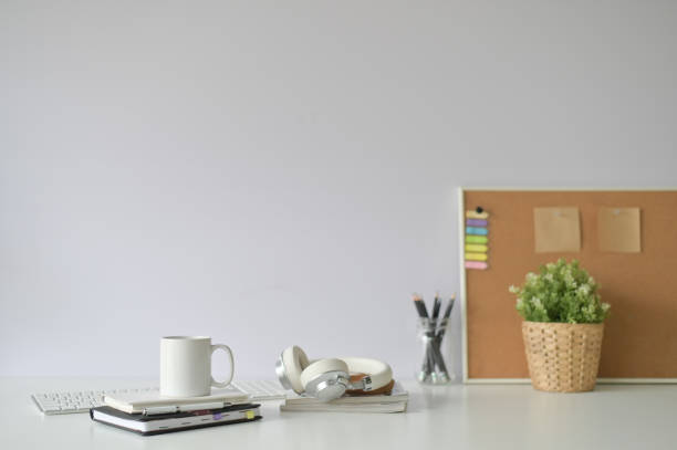 istock Copy space office desk with coffee mug, notebook and office supply with selective focus. 1083579742