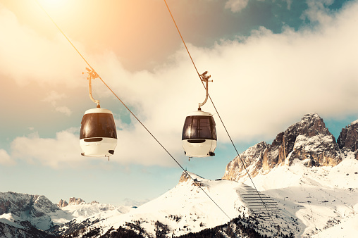 Ski lift cabin in ski resort in winter Dolomite Alps. Val Di Fassa, Italy.