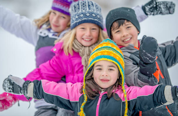 istock Four kids playing in winter 1083584002