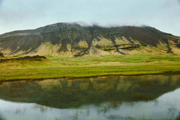 Bright green meadow and mountains