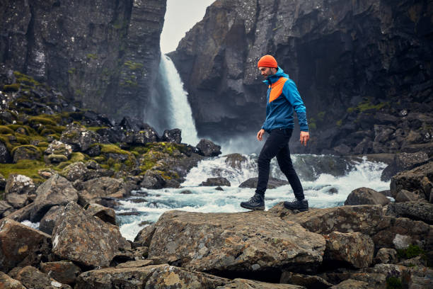 istock Crossing the stream. Mountain landscape 1083584420