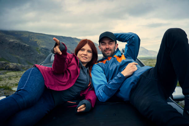 istock Couple enjoying glacier lagoon from car mask 1083584426