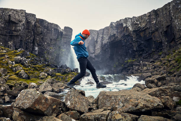 Crossing the stream. Mountain landscape