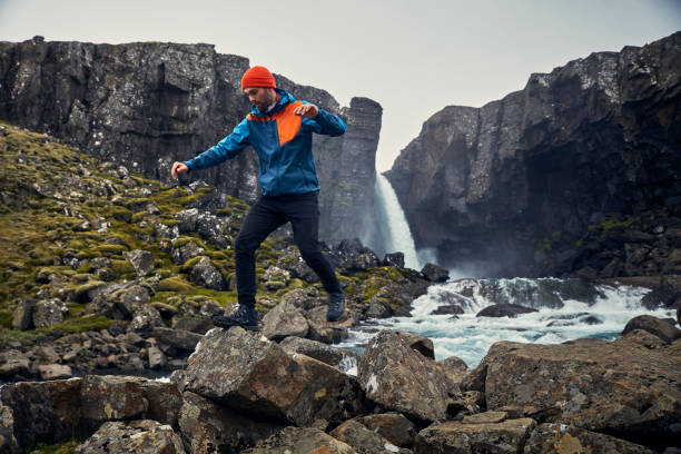 istock Crossing the stream. Mountain landscape 1083584652