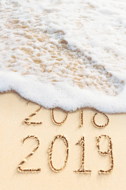 istock 2018 and 2019 handwritten on the beach 1083584748