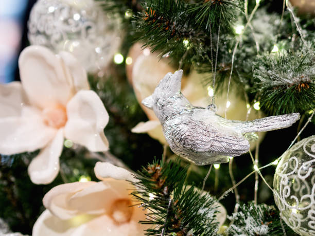 istock Elegant metal bird on silver thread, New Year decoration for Christmas tree. 1083586248