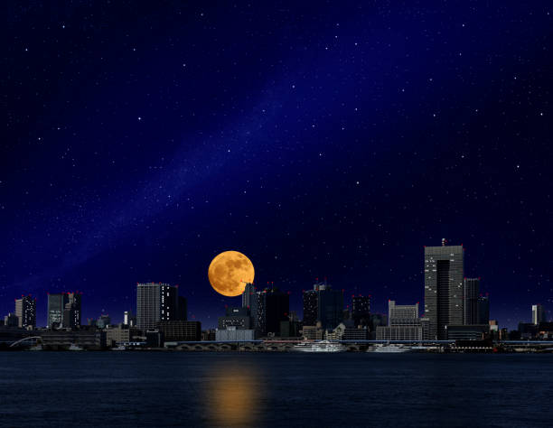 istock Full moon rising over the Tokyo bay area 1083586554