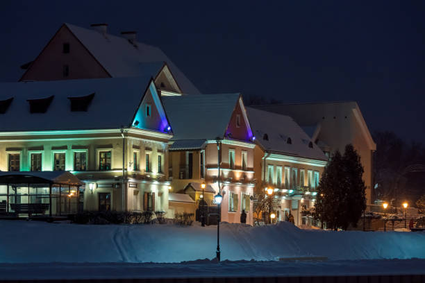 City buildings decorated and illuminated before winter holidays. City illumination at night