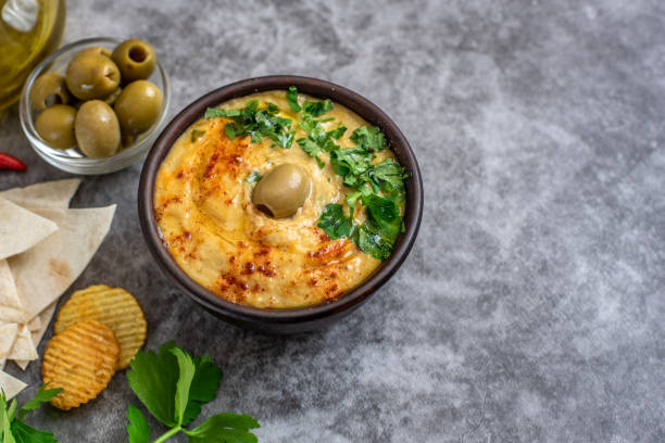 istock Classic hummus in bowls on a grey background. With copy space 1083597330