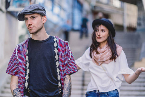 istock Young man turning back at his girlfriend 1083598012