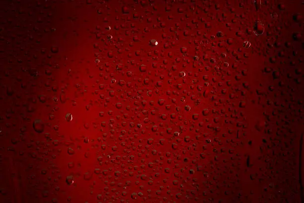 Photo of Ice cold glass fresh coca cola covered with water drops condensation Cold drink Drops of water cola drink background Raindrops texture Close up