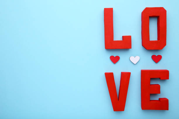 istock Red letters love on blue background. LOVE word. 1083608504