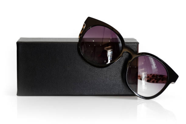 Fashionable sunglasses with box on white background