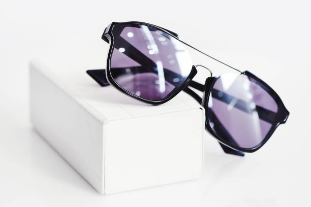 istock Fashionable sunglasses with box on white background 1083608848