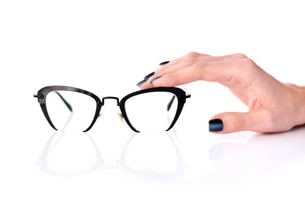 istock Beautiful glasses whit female hand on white background 1083608878